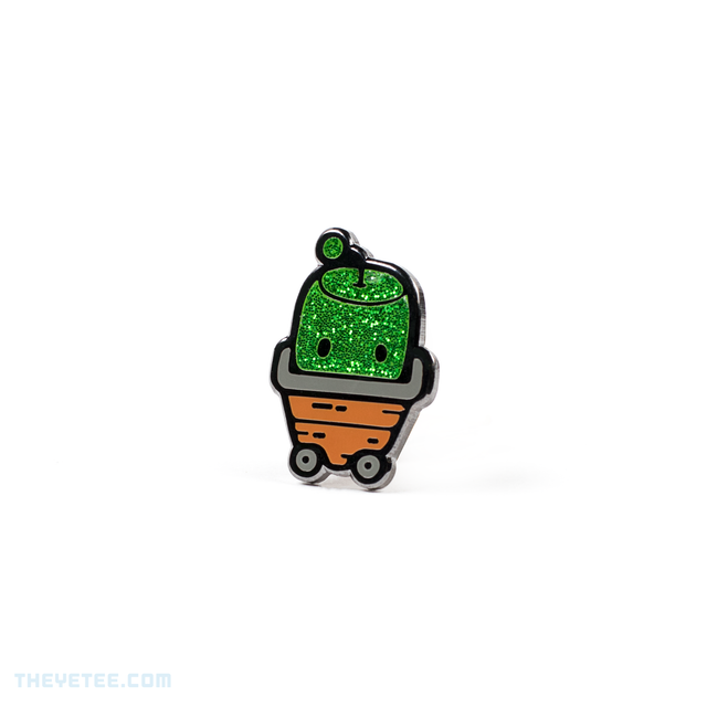 Hard enamel pin of a green sparkly Junimo- a forest spirit in Stardew Valley riding in a garden cart - Forest Spirit Pin
