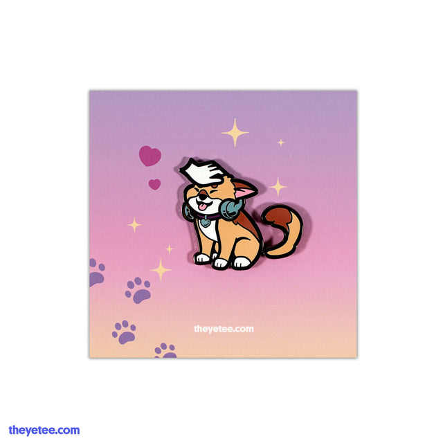 Enamel pin of tail wagging dog wearing headphones with white hand petting head - Wagging Tail