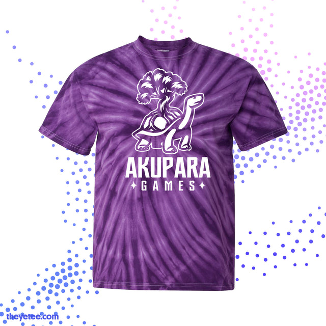 Purple tie-dye with the Akupara Games logo on the front in white. Logo is a tortoise carrying a tree on its shell. - Akupara Games Tee