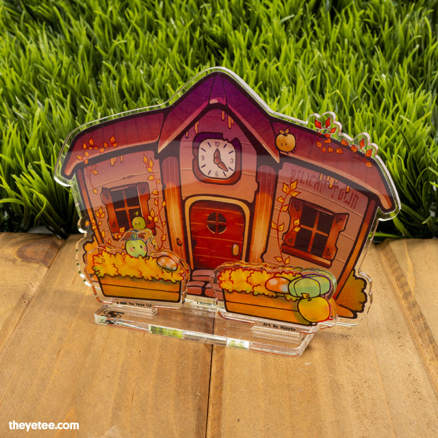 Acrylic standee of Pelican Town Hall in autumn with clock above doorway, junimos playing in flower beds and autumnal leaves.  - Renovations Finished For Autumn