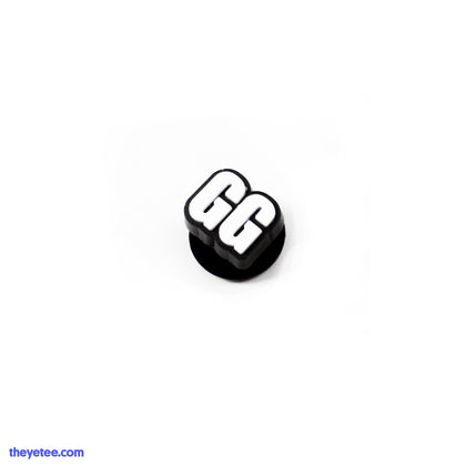 Short for "Good Game", this charm is two white letter G's.