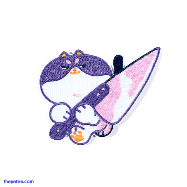 Iron on patch of purple cat with sly smirk holding knife - A KNIFE Patch