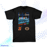 Black T-shirt shows a scene from Annalynn in arcade style design. 