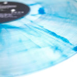 Close up of clear vinyl w/ Blue Streaks 12” LP - Lagrange Point