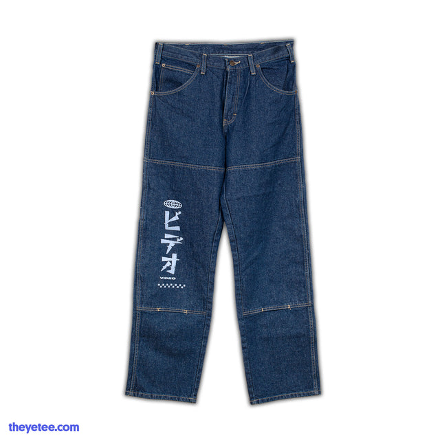 Straight leg denim jean with tan stitched seams on upper thighs and mid calves White kanji screen print on thigh says video - Bideo Worldwide Jeans