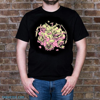 Black tee shirt. Legends from Brawlhalla fighting in a cloud of dust. Shirt includes code for free in-game Yetee Teros skin.