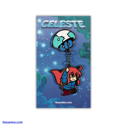 Hard enamel pin of blue jellyfish parachute flying holding chain with Madeline hanging from end