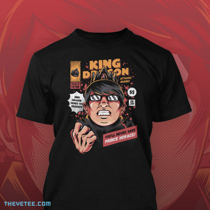 Black shirt following comic book cover motif, King Dragon grimaces with a clenched fist. You'll never save Prince Horace!