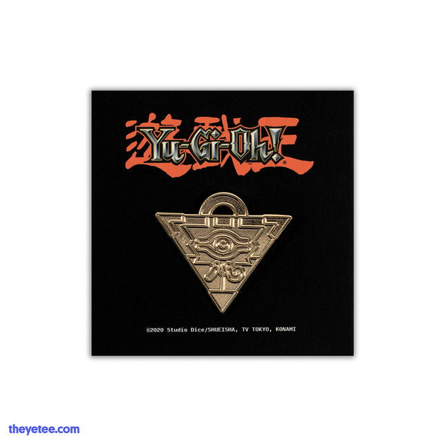 Hard enamel pin of Yugi's gold Millenium Puzzle piece, an upside down triangle with an eye on the front and half ring on top - Millennium Puzzle Pin