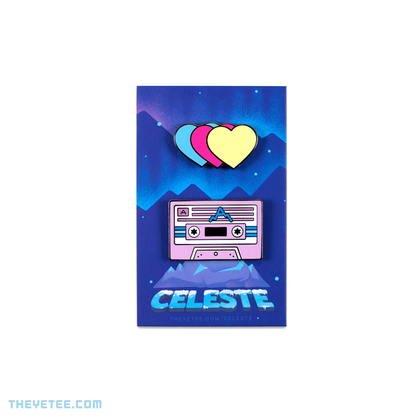 Teal, pink and yellow hearts attached to each other. Second pin is a cassette with a small mountain ridge in the center.