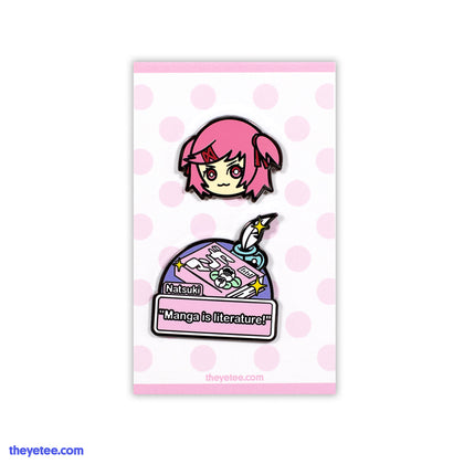 Pin of Natsuki's head wearing red crossed hairclip and two side ponytails. 2nd pin is manga captioned "Manga is literature!"