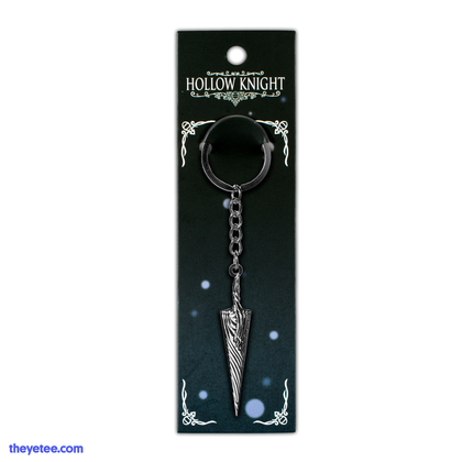 Silver Pure Nail keychain in black to blue ombre packaging.