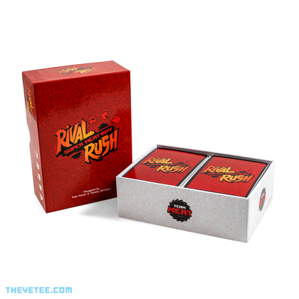 Lid of the box set stands upright next to the box component holding the cards. Lid is red with and the box is white.