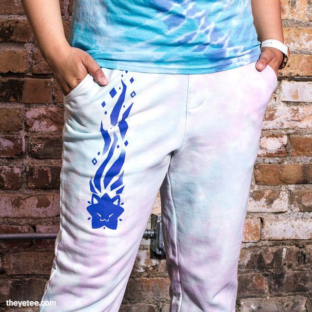 Blue and purple pastel tie-dye sweatpants with cobalt blue cat-shaped shooting star design down the left thigh.  - Void Amaro Sweatpants