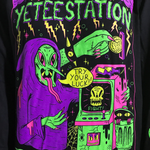 Main design on chest features green pointy-nosed wizard in purple hooded cloak with their arm around a retro arcade machine. - Welcome to the Yetee Station Longsleeve