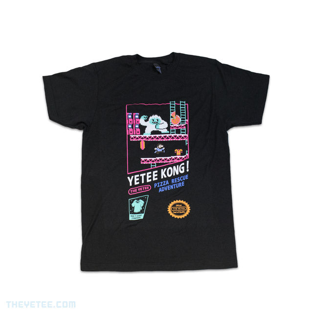Black tee shirt with pixelated design centered on chest. In a retro construction site, protagonist must dash and jump across platforms while steering clear of the Yetee to rescue their beloved pizza. - Yetee Kong Retro