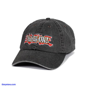 Grey denim dad hat with embroidered Yu-Gi-Oh logo on front above the bill. Inside the hat is the Official Licensed Seal. 