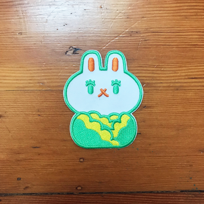 Iron on patch pf bunny head popping out of head of cabbage